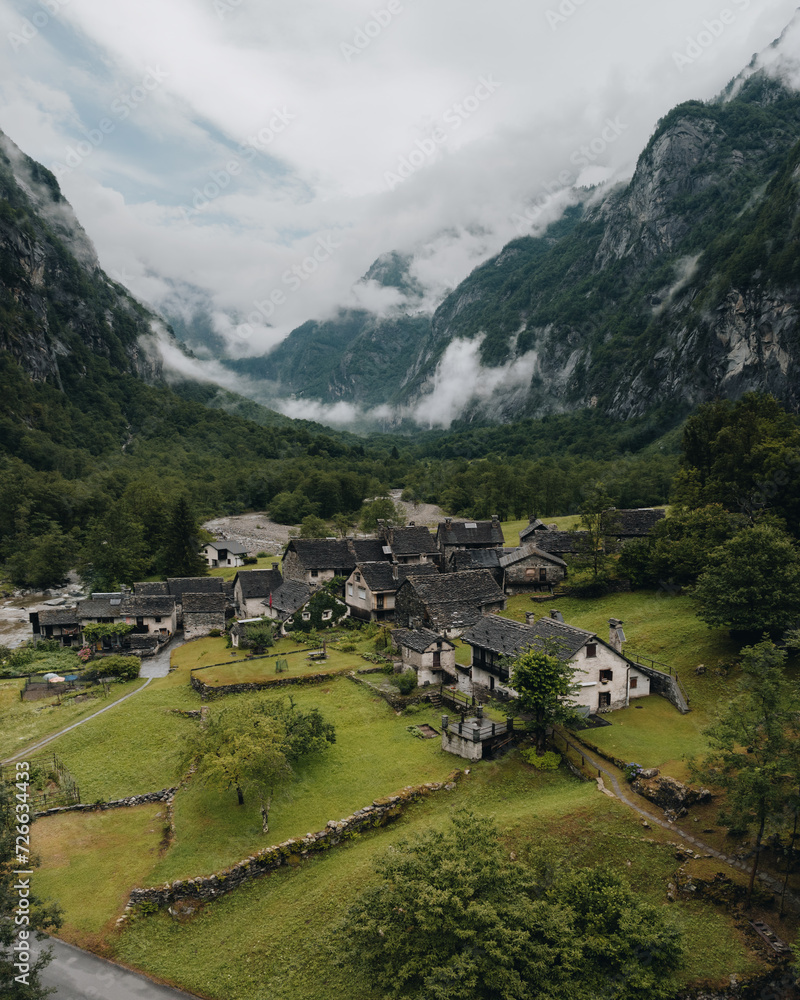 Sonogno village in Swiss alps with waterfall nearby. - obrazy, fototapety, plakaty 