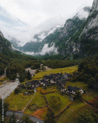Sonogno village in Swiss alps with waterfall nearby.