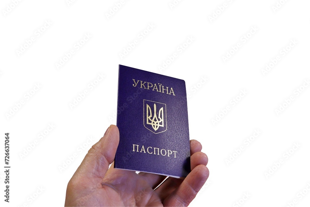 Passport of a citizen of Ukraine in a man’s hand on a white background. Passport of a citizen of Ukraine in a man’s hand on a white background.