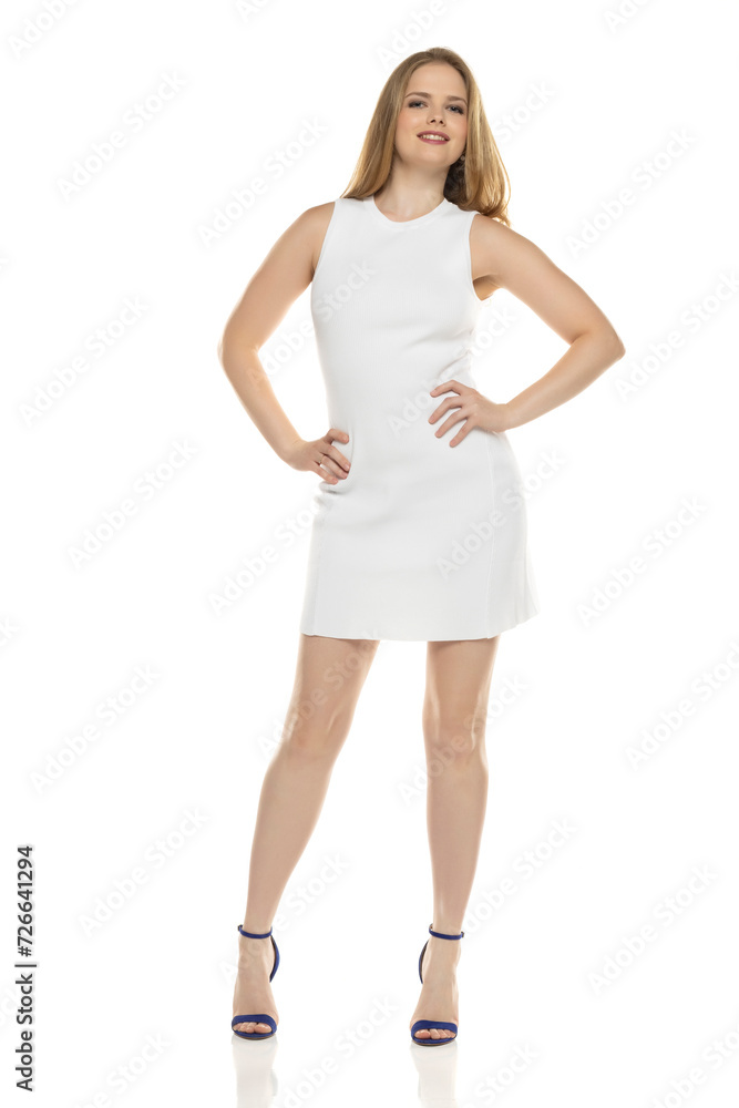 Full body front view portrait of elegant lovely blond lady posing isolated on white background Full body front view portrait of elegant lovely blond lady posing isolated on white background