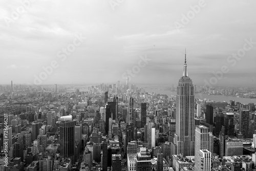 Black and white view of New York City skyline looking down past the Empire State Building towards downtown skyscrapers with vintage colors giving off a 90's feel © andrew