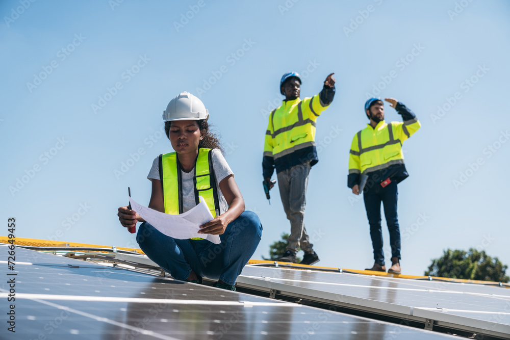 Service engineer checking solar cell on the roof for maintenance if there is a damaged part. Engineer worker install solar panel. Clean energy concept. Service engineer checking solar cell on the roof for maintenance if there is a damaged part. Engineer worker install solar panel. Clean energy concept.
