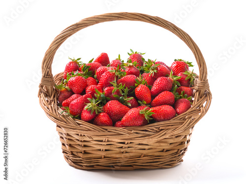 Vintage basket full of freshly harvested ripe strawberries, vibrant red healthy and yummy fruits, isolated on white 