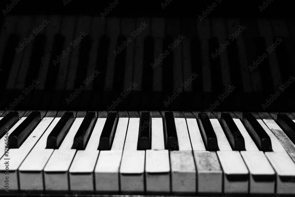 The keyboard of a classic old grand piano in close-up The keyboard of a classic old grand piano in close-up