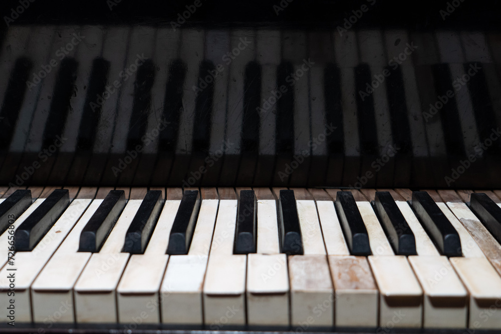 The keyboard of a classic old grand piano in close-up The keyboard of a classic old grand piano in close-up
