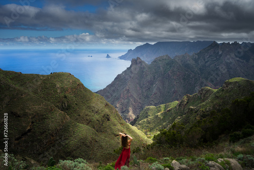 Beautiful girl in red dress in Taborno valley, Tenerife, Canaries, Spain photo