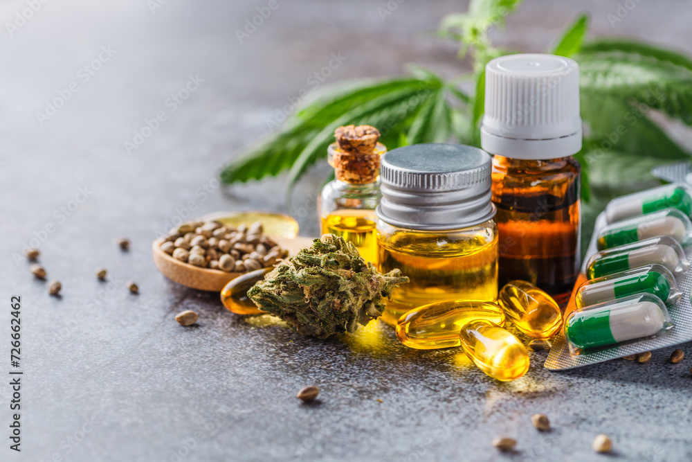 Green leaves of medicinal cannabis with extract oil.Medical marijuana flower buds. Hemp buds - medical marijuana concept Green leaves of medicinal cannabis with extract oil.Medical marijuana flower buds. Hemp buds - medical marijuana concept