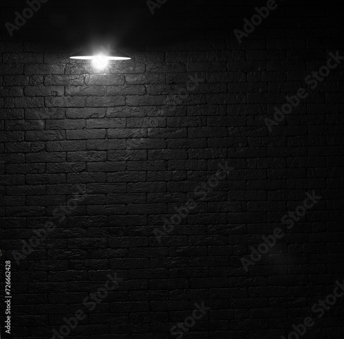 chandelier lamp in a black brick room
