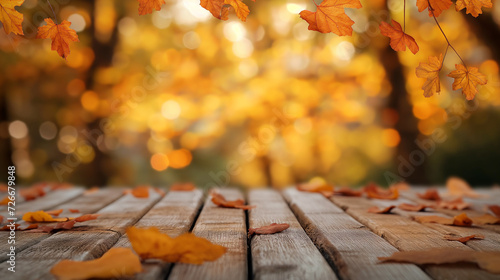 Autumn leaves on the wooden background