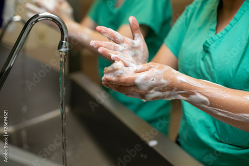 фотографія Doctors and Nurses Scrubbing In