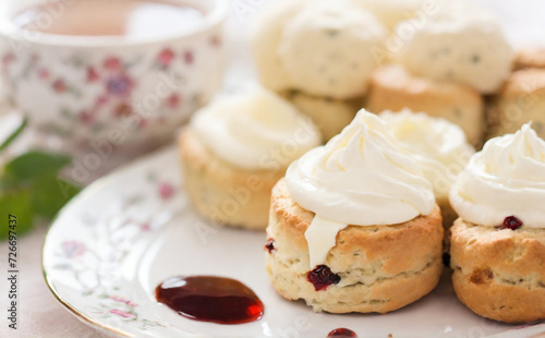 cup of coffee and cake. Traditional English afternoon tea scones with clotted cream