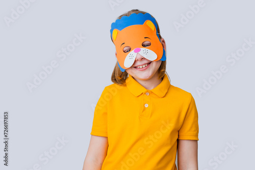 Obraz na plátně Child wearing bear mask on a gray background