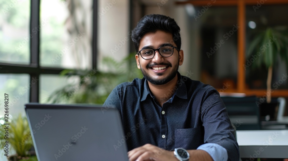 a smiling Indian man with his laptop in an office, in the style of future tech, wealthy portraiture, precision engineering a smiling Indian man with his laptop in an office, in the style of future tech, wealthy portraiture, precision engineering