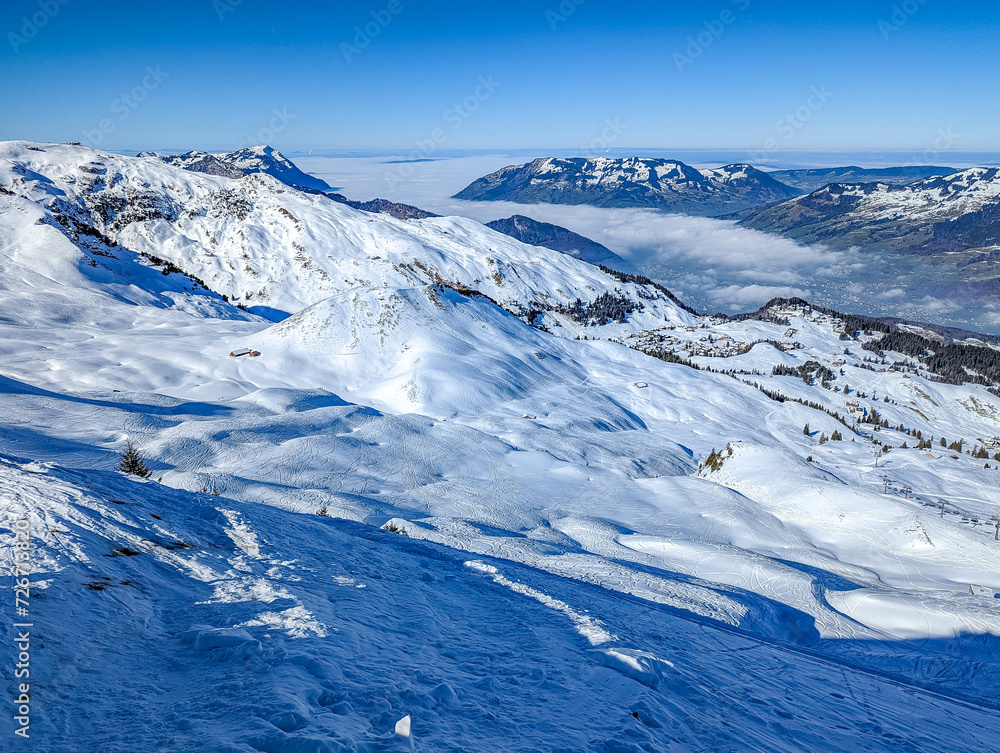 Fototapeta premium Aerial drone view of snow covered ski slopes at Stoos,Switzerland