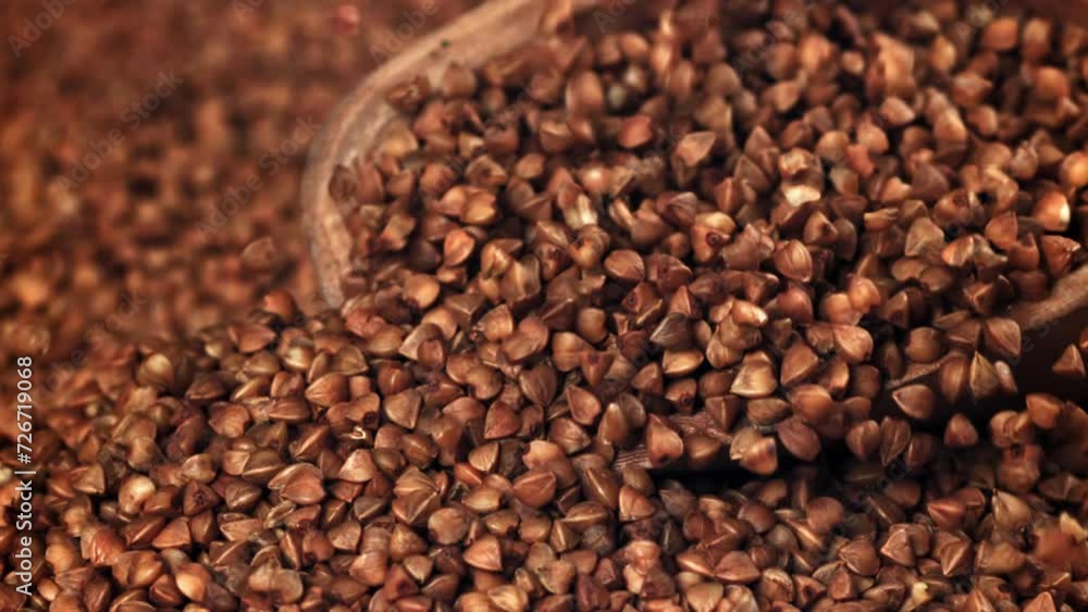Buckwheat falling into a pile with a scoop. Filmed on a high-speed camera at 1000 fps. High quality FullHD footage Buckwheat falling into a pile with a scoop. Filmed on a high-speed camera at 1000 fps. High quality FullHD footage