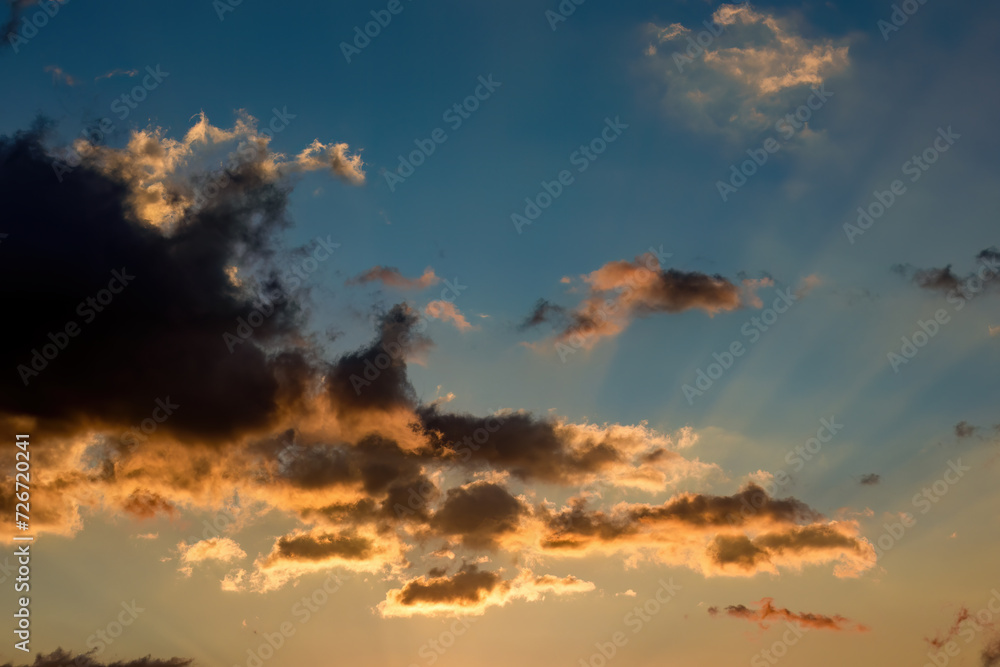 The projection of light and shadows by the sun through a little dense cloud, over the eastern Andes mountains of central Colombia at sunset.