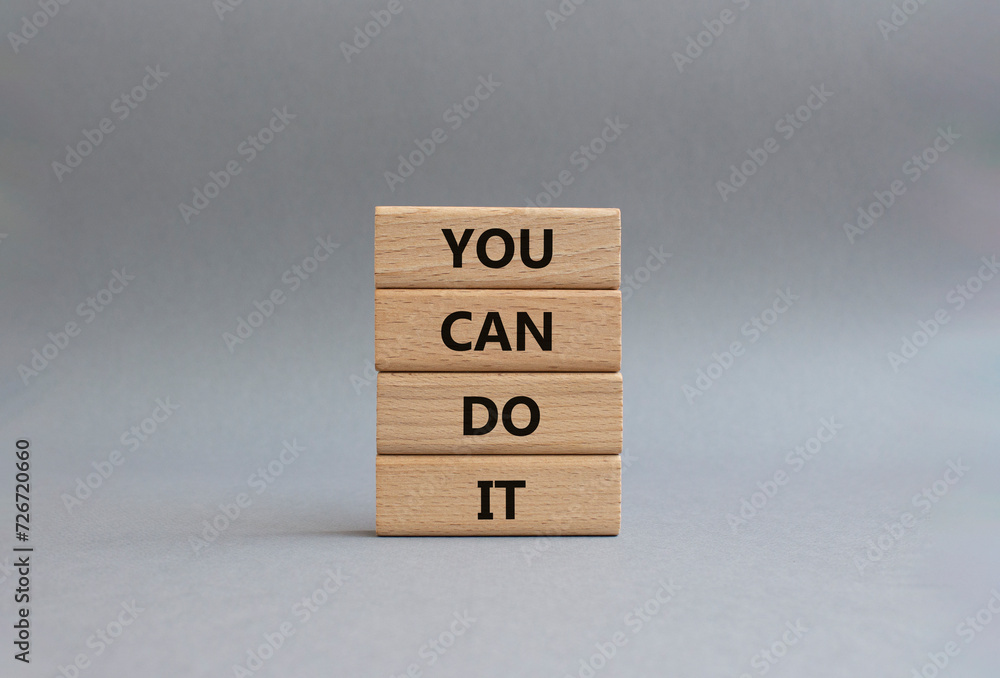 You can do it symbol. Concept words You can do it on wooden blocks. Beautiful grey background. Business and You can do it concept. Copy space. You can do it symbol. Concept words You can do it on wooden blocks. Beautiful grey background. Business and You can do it concept. Copy space.