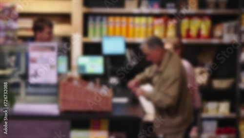 customers and cashier in local grocery shop