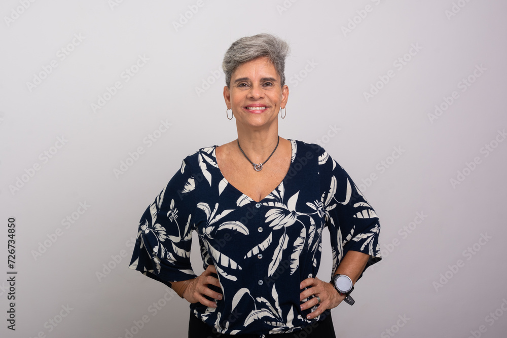 Beautiful smiling silver-haired woman looking at the camera. Confident and happy person. Beautiful smiling silver-haired woman looking at the camera. Confident and happy person.