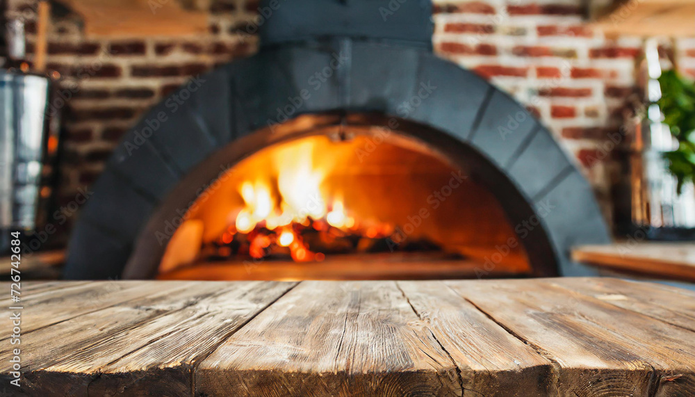Empty table with blurred pizza oven background