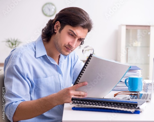 Young male employee working at home