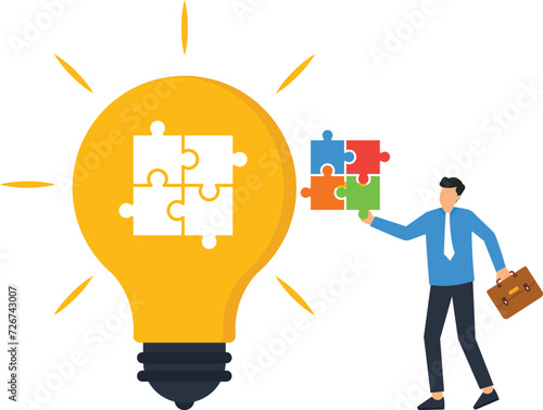 Finishing lightbulb with a jigsaw puzzle, Business creativity and symbol of inspiration or creative thinking for business success concept,
