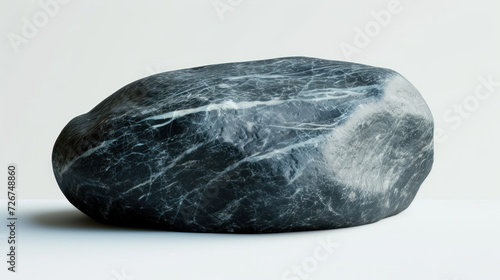 Polished Shungite stone with its lustrous black finish and powerful presence, set against a clean white backdrop photo