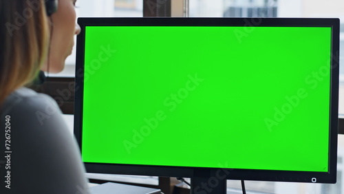 Call operator using chromakey computer closeup. Corporate manager looking green