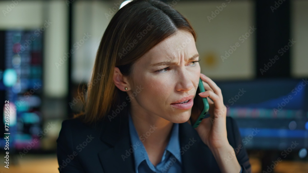Serious woman talk mobile phone in office closeup. Nervous businesswoman discuss Serious woman talk mobile phone in office closeup. Nervous businesswoman discuss