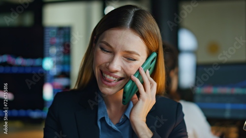 Smiling entrepreneur talking smartphone in office closeup. Happy worker enjoying