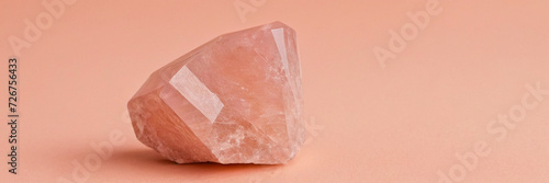 pink amethyst crystals on peachy background photo