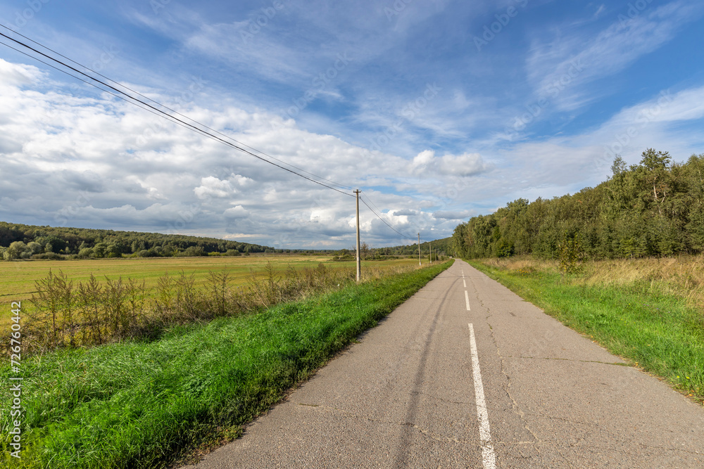 asphalt road panorama in countryside on sunny summer day asphalt road panorama in countryside on sunny summer day