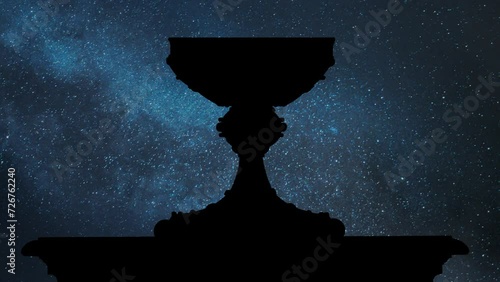 Iconic Sacred graal or Holy grail by Night, Time Lapse with Stars and Milky Way in Background photo