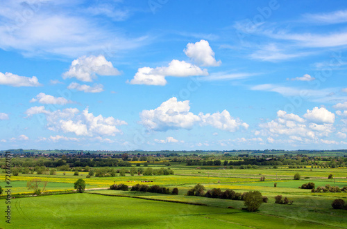 Fototapeta Naklejka Na Ścianę i Meble -  Views from Burrow Mump overlooking the surrounding countryside of Southlake Moor in Burrowbridge Somerset on a sunny day
