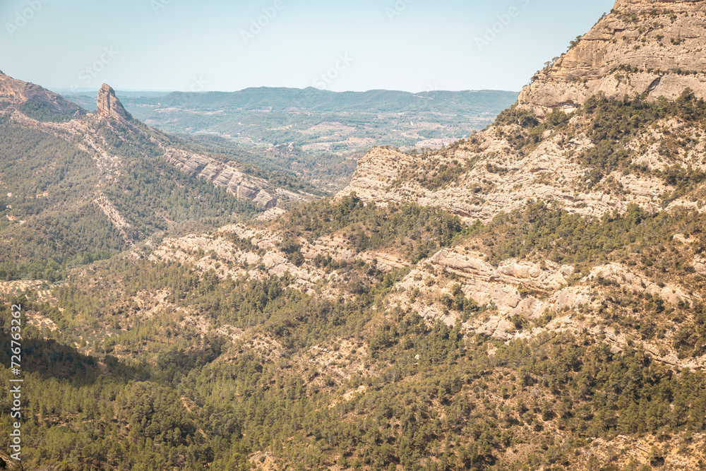 Mountain landscape next to La Fontcalda (warm spring), area of Pandols-Cavalls mountain range, Prat de Comte, Tarragona, Catalonia, Spain