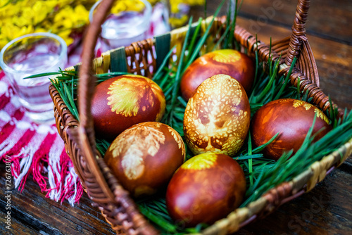 traditional Easter eggs in basket painted by boiling in red onion leaves - organic food