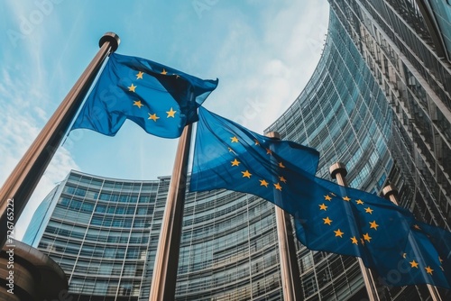 Fluttering EU flag in front of glass building