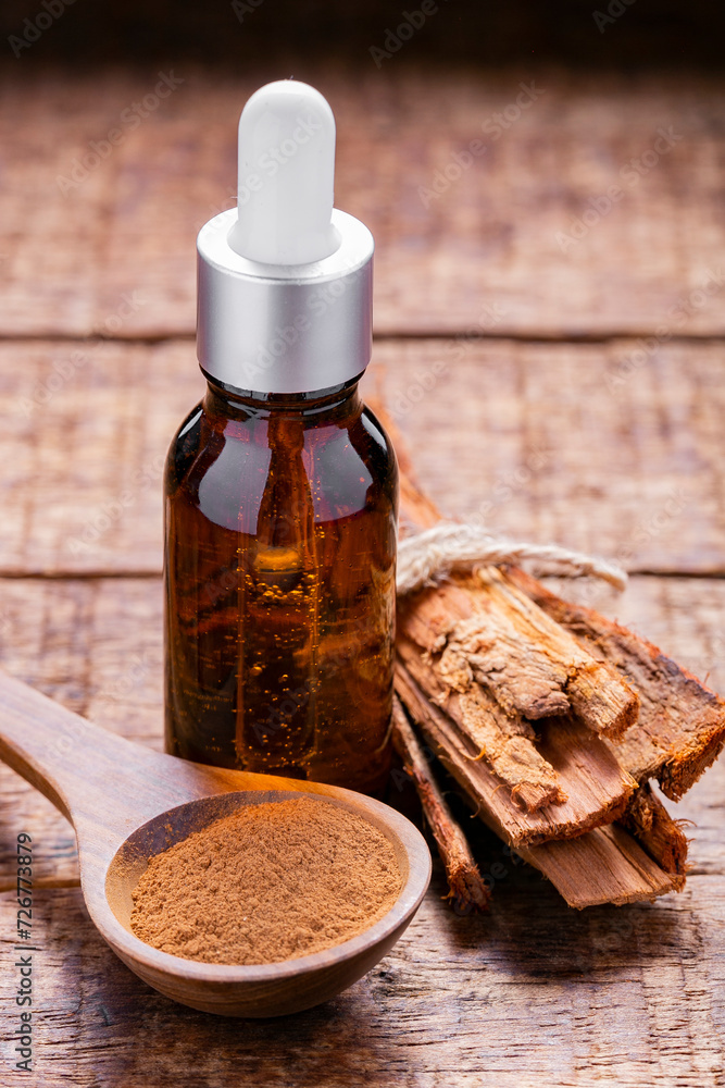 Splinters, powder and essence of cinnamon, on the old table Splinters, powder and essence of cinnamon, on the old table