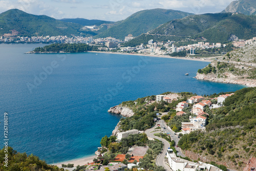 Top view of Budva riviera on a sunny day, Montenegro. Coast background for publication, design, poster, calendar, post, screensaver, wallpaper, cover, website. High quality photo