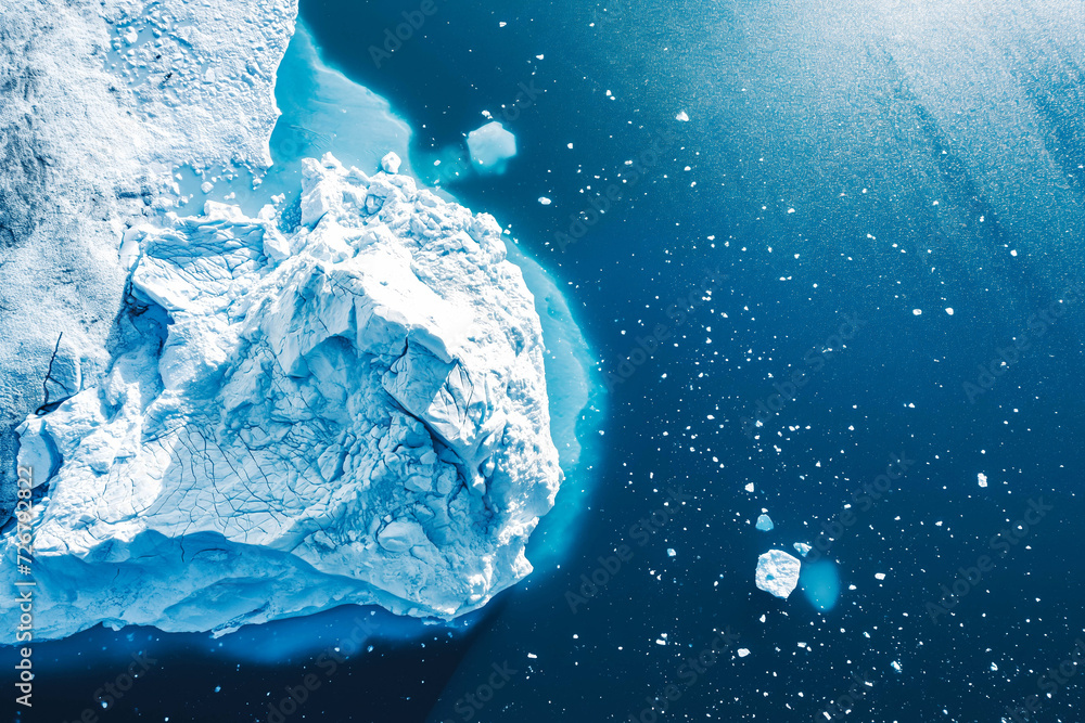 Iceberg and ice from glacier in arctic nature landscape on Greenland. Aerial photo drone photo of icebergs in ice fjord. Affected by climate change and global warming Iceberg and ice from glacier in arctic nature landscape on Greenland. Aerial photo drone photo of icebergs in ice fjord. Affected by climate change and global warming