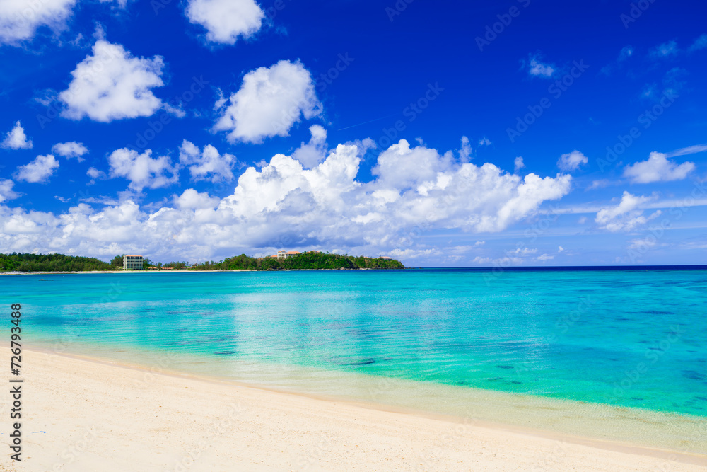 Beautiful view of tropical blue sea or ocean by the white beach and floating a cloud in summer, Okinawa in Japan, Nobody, Landscape or travel, High resolution over 50MP for wallpaper Beautiful view of tropical blue sea or ocean by the white beach and floating a cloud in summer, Okinawa in Japan, Nobody, Landscape or travel, High resolution over 50MP for wallpaper