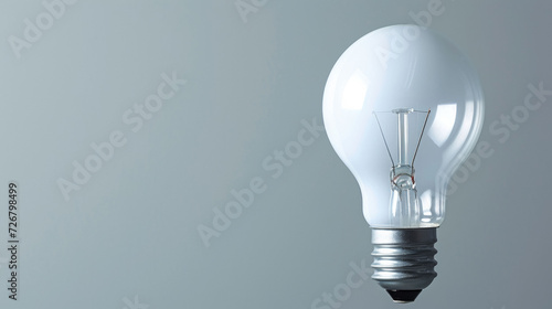 Bright White Light Bulb on a Plain Background