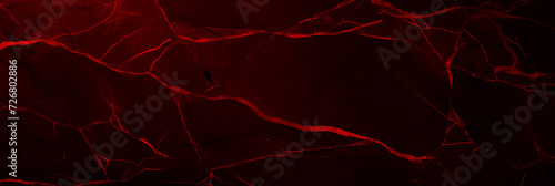 Wide burgundy grunge banner. Abstract stone wall texture background. Close-up shot red veins. Dark rock backdrop with copy space