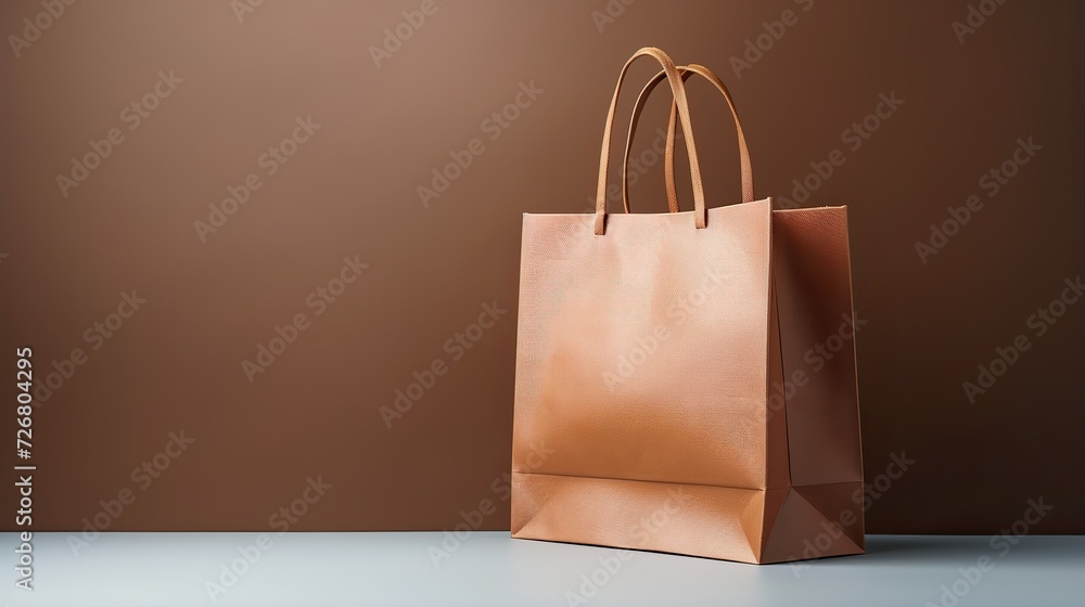 A shopping bag positioned against a clean and simple background, emphasizing minimalism and highlighting the bag as the focal point A shopping bag positioned against a clean and simple background, emphasizing minimalism and highlighting the bag as the focal point