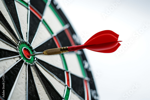 Strategic, Goals business and achievement concept. Bullseye target or dart board has red dart arrow throw hitting the center of a shooting. Perfection and Success.