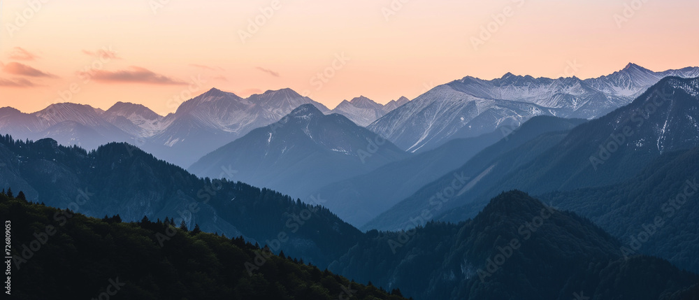 Breathtaking View of Snow-Capped Peaks at Twilight: A Serene Landscape Immersed in Nature's Splendor