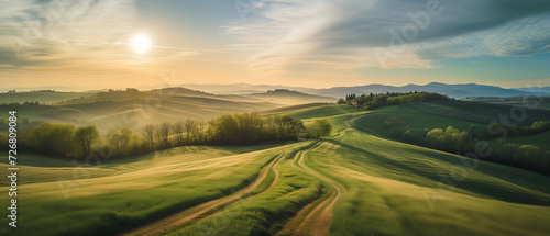 Sunrise Over Rolling Hills: A Lush Tapestry of Verdant Fields Under a Radiant Morning Sky