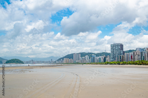 Clouds and Blue Skies Over Tropical Beach With City Skyline of Santos Sao Paolo in Brazil © Brandon