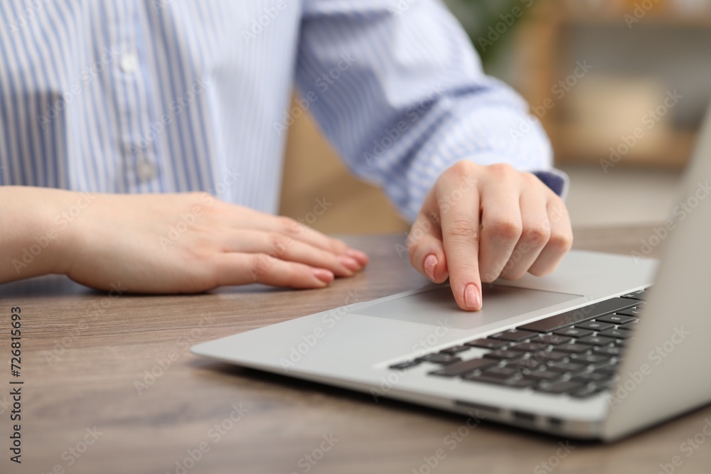 E-learning. Woman using laptop during online lesson at table indoors, closeup E-learning. Woman using laptop during online lesson at table indoors, closeup