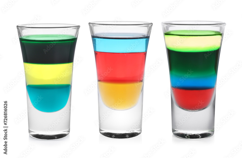 Different shooters in shot glasses isolated on white, set Different shooters in shot glasses isolated on white, set